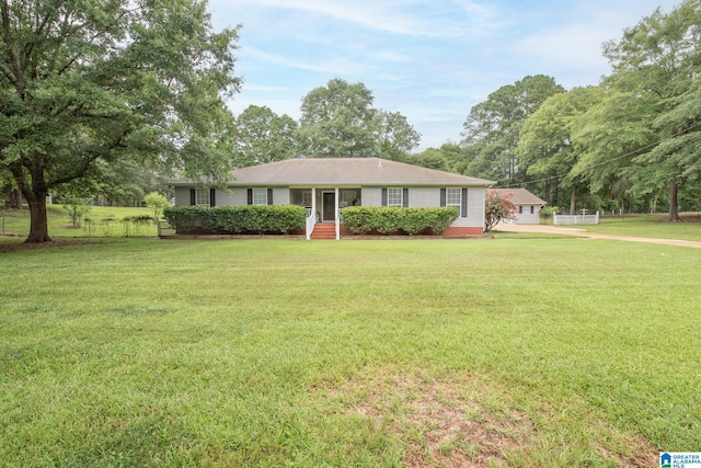 ranch-style house with a front lawn