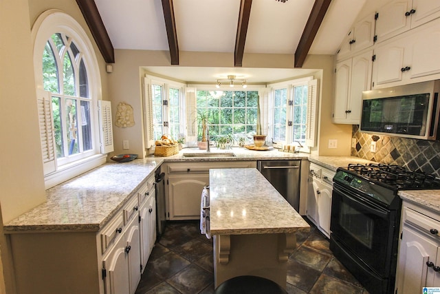 kitchen featuring light stone countertops, decorative backsplash, plenty of natural light, and stainless steel appliances