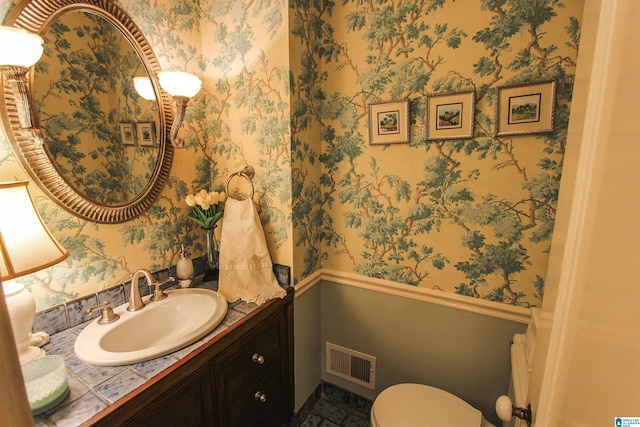 bathroom with vanity and toilet