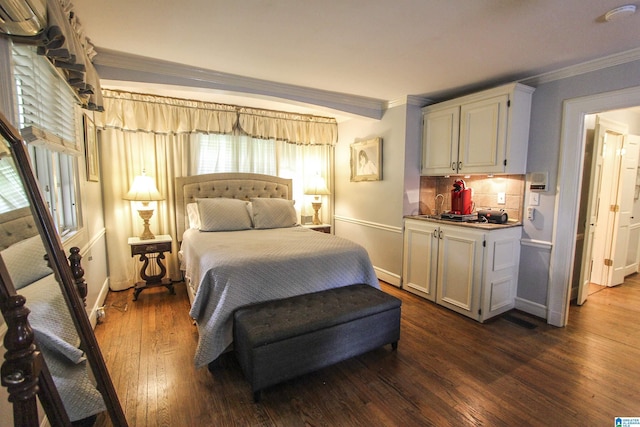 bedroom featuring crown molding and dark hardwood / wood-style floors