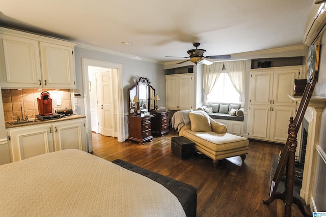 bedroom with crown molding, dark wood-type flooring, sink, and ceiling fan