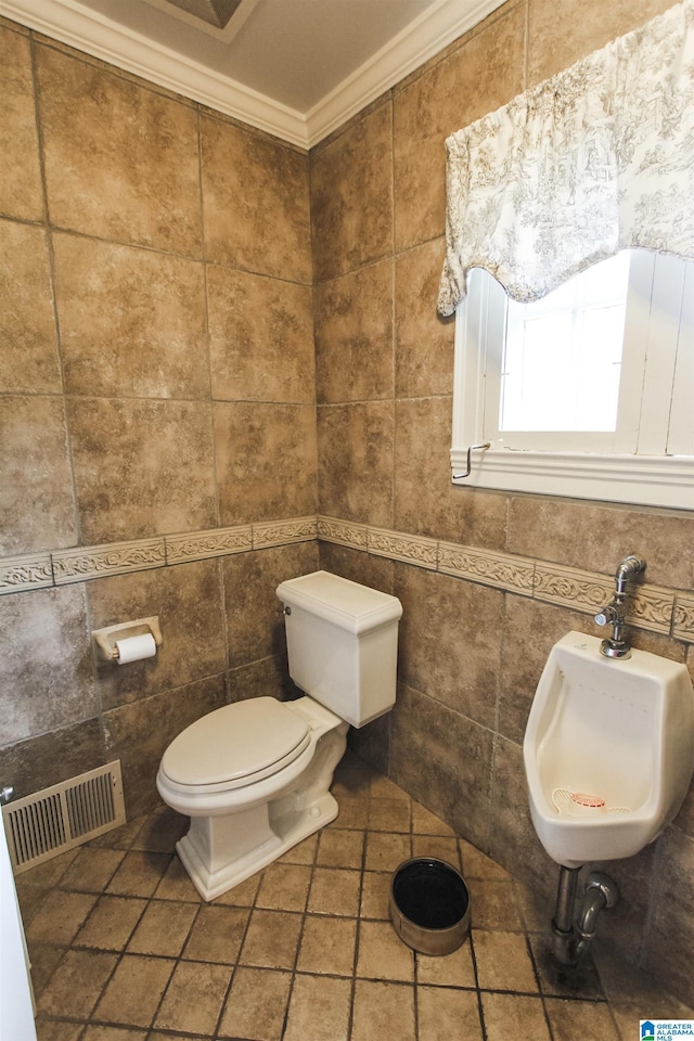 bathroom with sink, crown molding, tile patterned flooring, tile walls, and toilet