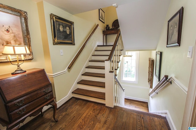 stairway with hardwood / wood-style floors