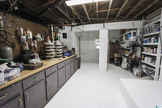 basement with a workshop area