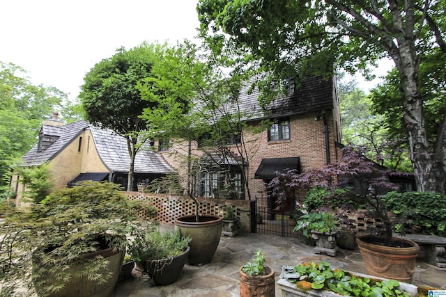 back of property featuring a patio area