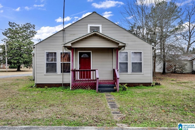 bungalow-style house with a front yard