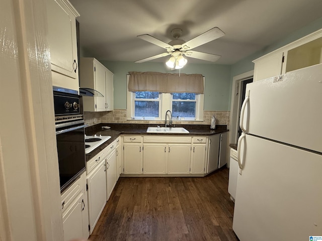 kitchen featuring sink, white appliances, dark hardwood / wood-style floors, and white cabinets