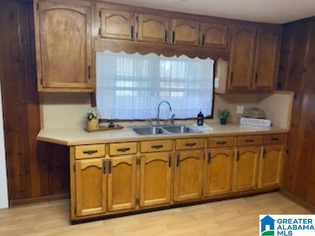 kitchen with sink and light hardwood / wood-style floors