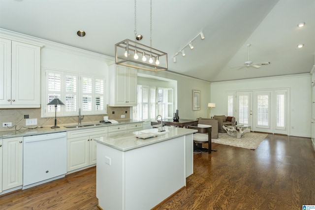 kitchen with sink, decorative light fixtures, dishwasher, a kitchen island with sink, and white cabinets