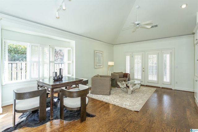 interior space featuring dark wood-type flooring, a wealth of natural light, ornamental molding, and ceiling fan