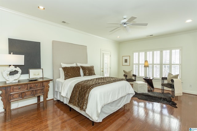 bedroom featuring ceiling fan, ornamental molding, and wood-type flooring