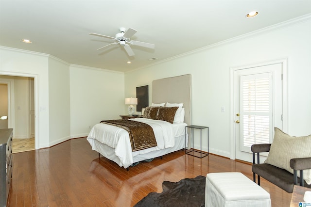 bedroom with dark hardwood / wood-style flooring, crown molding, and ceiling fan