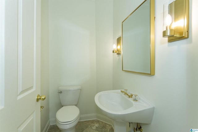 bathroom with sink and toilet