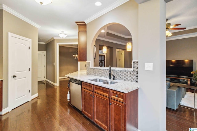 kitchen with sink, light stone counters, hanging light fixtures, dark hardwood / wood-style flooring, and dishwasher