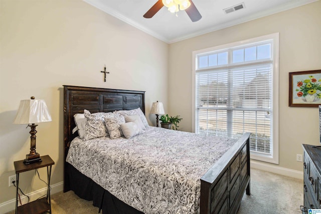 carpeted bedroom featuring multiple windows, crown molding, and ceiling fan