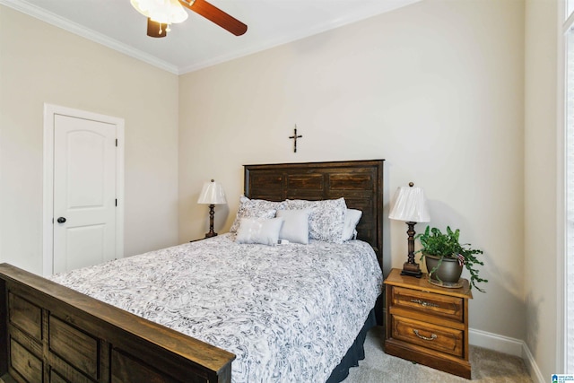 bedroom featuring crown molding, ceiling fan, and carpet flooring