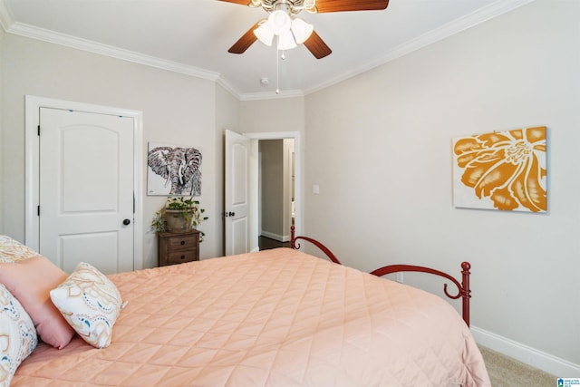 carpeted bedroom featuring ceiling fan and ornamental molding