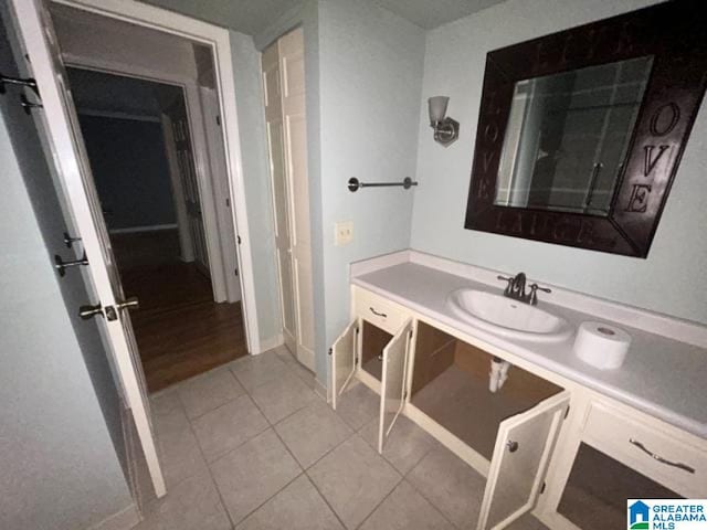 bathroom with tile patterned flooring and vanity