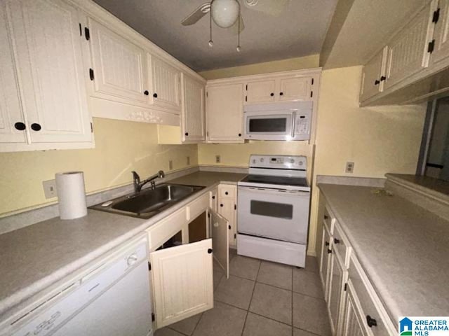 kitchen with sink, white appliances, light tile patterned floors, and ceiling fan