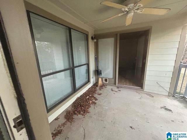 exterior space featuring ceiling fan