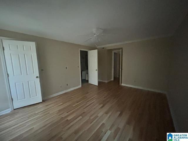 unfurnished bedroom with ceiling fan and light hardwood / wood-style floors