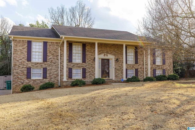 raised ranch featuring a front yard