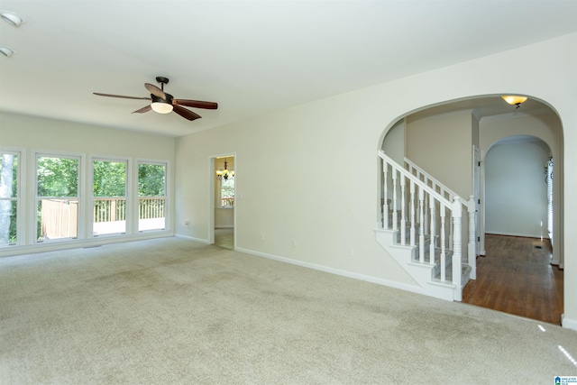 empty room with carpet flooring and ceiling fan