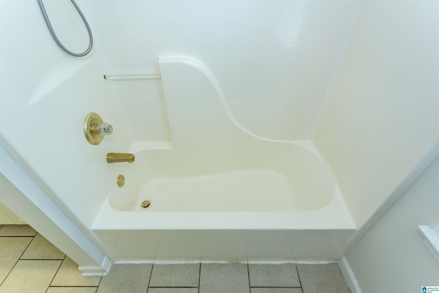 bathroom featuring tub / shower combination and tile patterned flooring