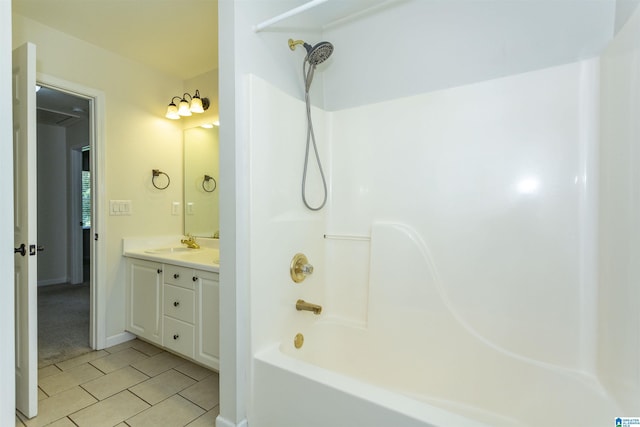 bathroom featuring tile patterned flooring, vanity, and bathtub / shower combination