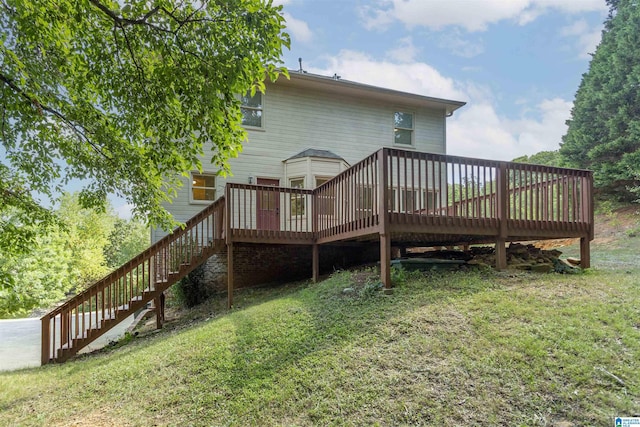 back of property featuring a yard and a deck