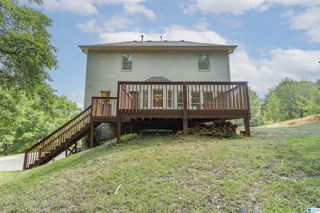 back of house with a yard and a deck