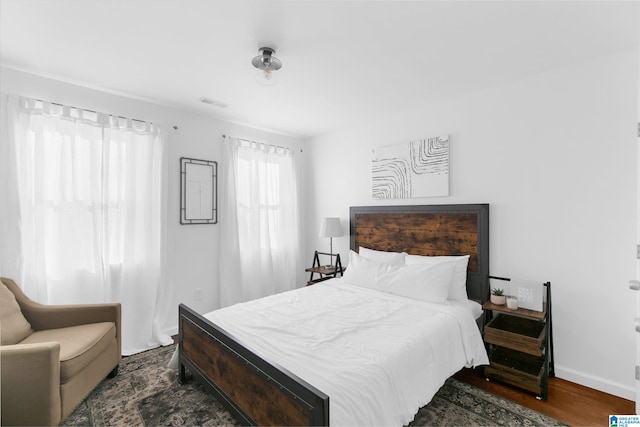 bedroom featuring dark hardwood / wood-style floors