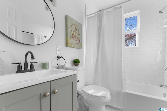 full bathroom featuring vanity, toilet, and shower / tub combo