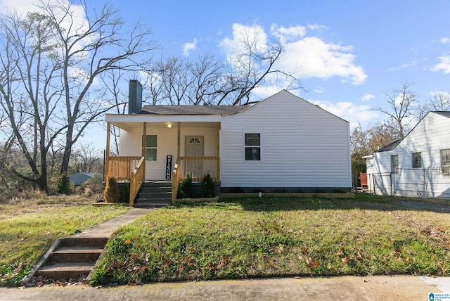 view of front of home featuring a porch and a front lawn