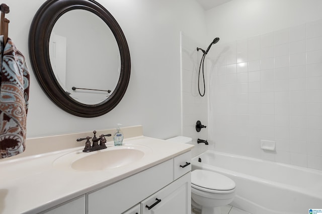 full bathroom featuring vanity, toilet, and tiled shower / bath