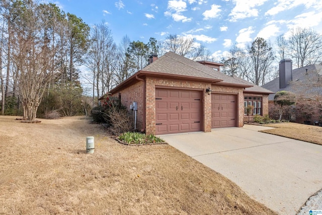 view of property exterior with a garage and a lawn