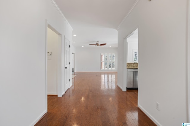 hall with hardwood / wood-style flooring and ornamental molding