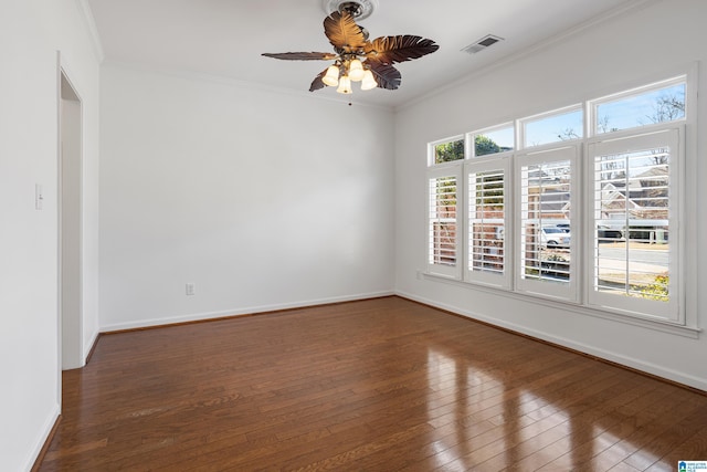 spare room featuring crown molding, ceiling fan, and dark hardwood / wood-style flooring