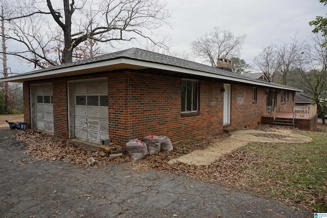 view of side of home with a garage