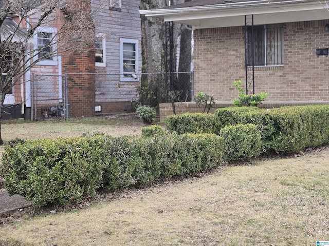 view of side of home with a lawn