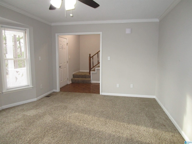 unfurnished room with crown molding, ceiling fan, and carpet flooring