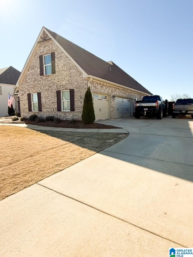 view of side of home featuring a garage