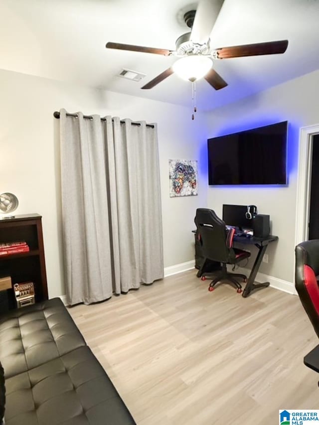 office featuring ceiling fan and light hardwood / wood-style floors