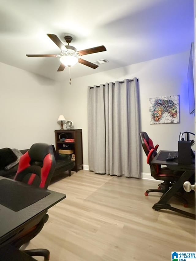 office with ceiling fan and light wood-type flooring