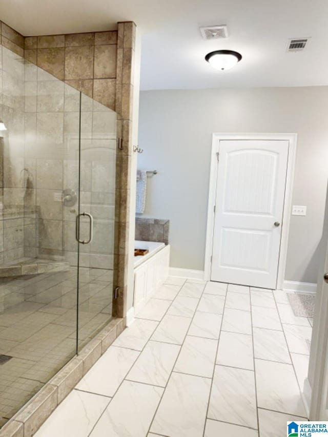 bathroom featuring plus walk in shower