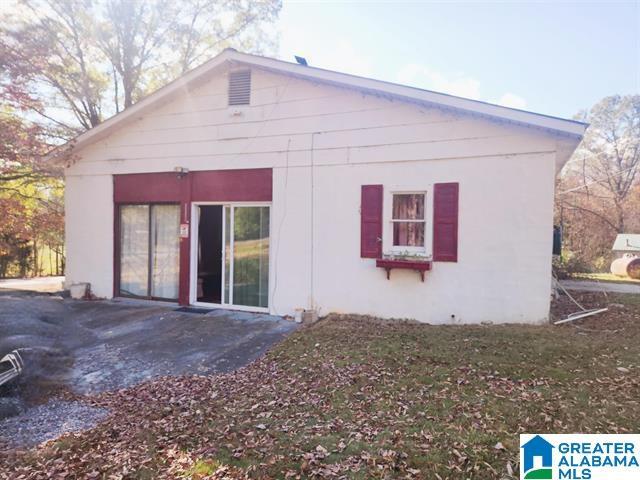 back of property with a patio