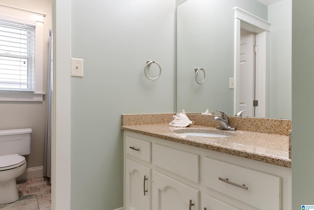 bathroom with vanity and toilet