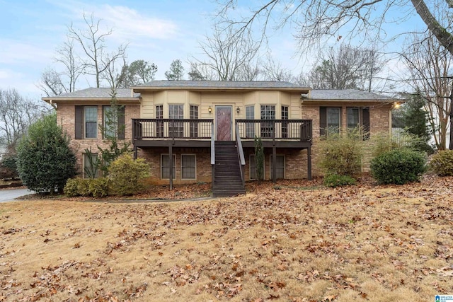 back of property featuring a deck