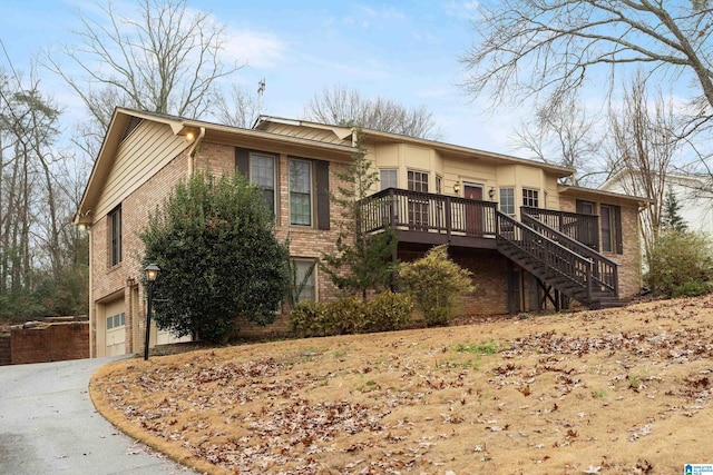 exterior space featuring a wooden deck and a garage