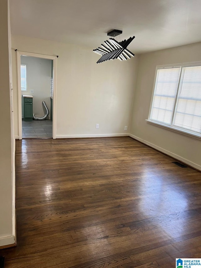 empty room featuring dark hardwood / wood-style flooring